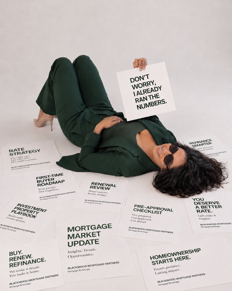 Sobitha surrounded by Blackwood Mortgage Partners campaign posters
